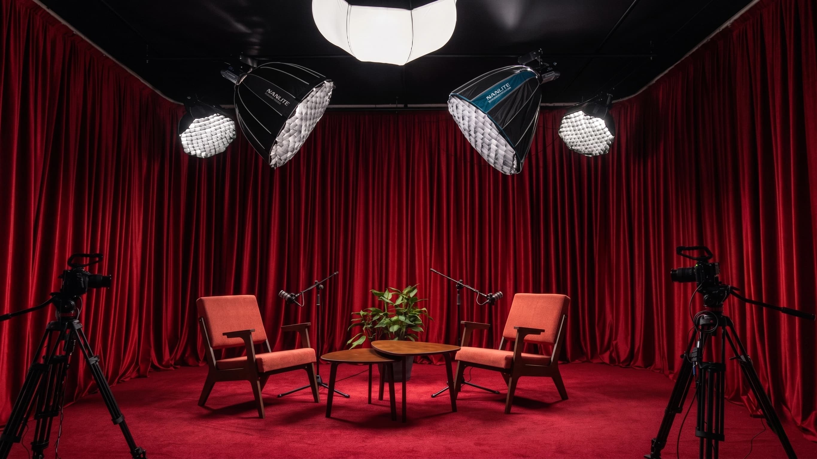 Podcaster studio with red curtains