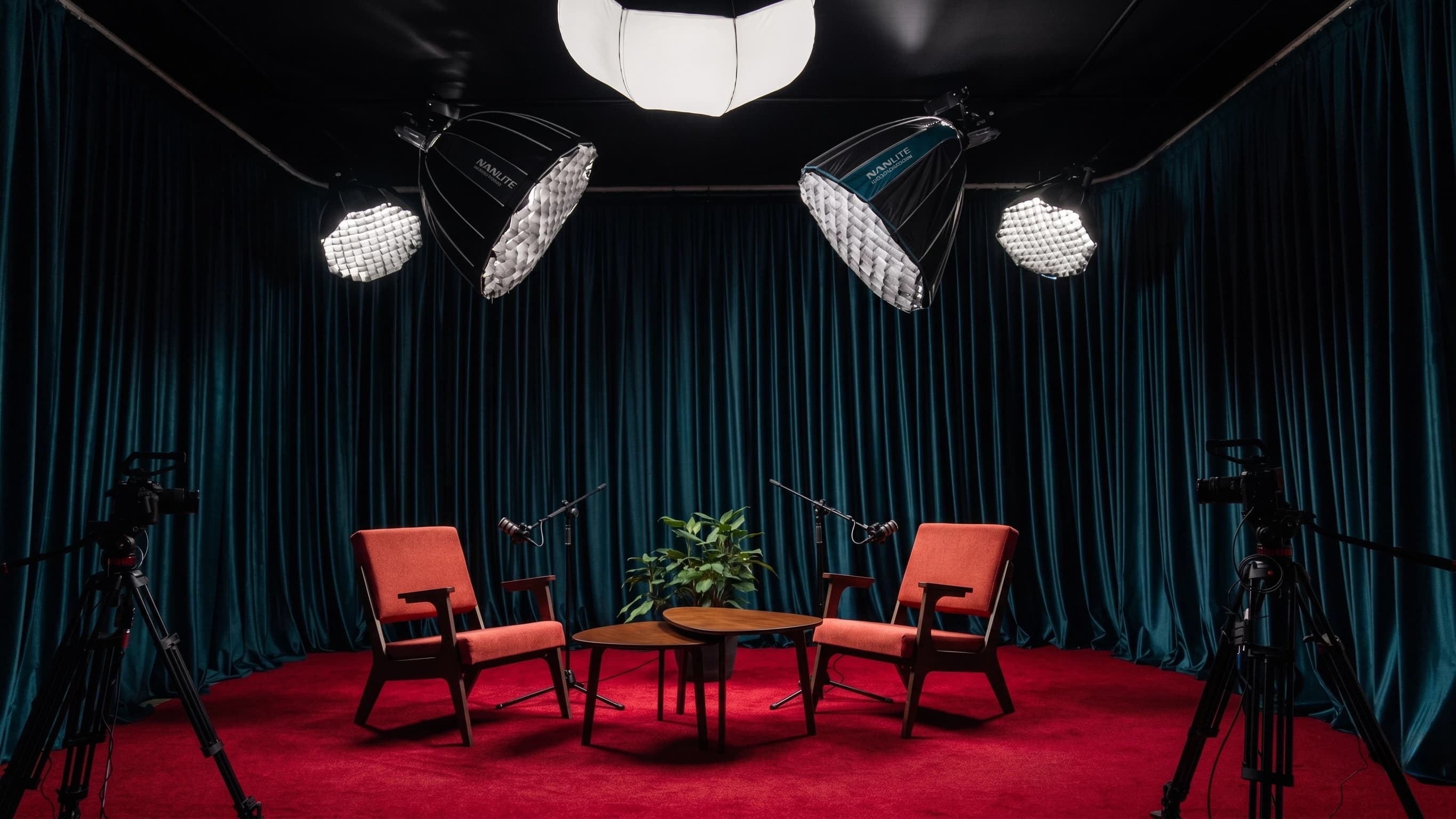 Podcaster.studio — teal curtain recording space